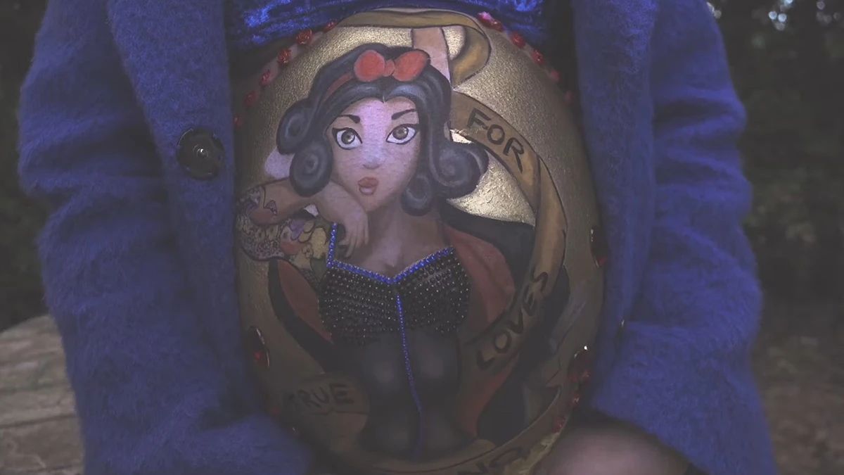 Tattoo of a character featuring professional video production elements, showcasing artistic detail and compliance with industry standards.